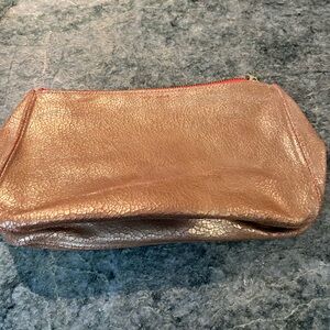 Tracey Tanner gold metallic clutch or makeup bag
